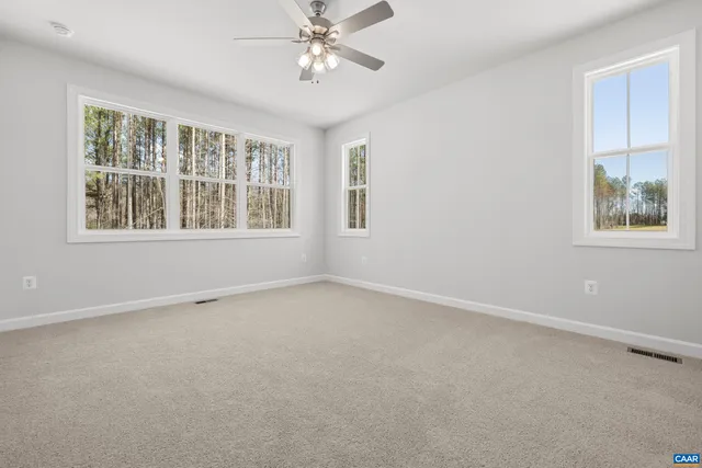 a white bath tub sitting next to a white sink