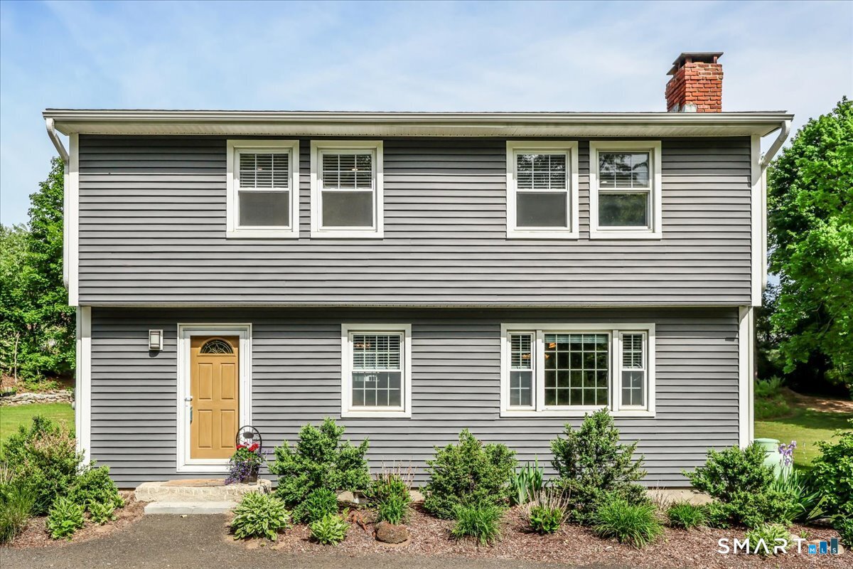 19 Botsford Hill Road Newtown, CT 06470 - Photo 36 of 40 a front view of a house with plants