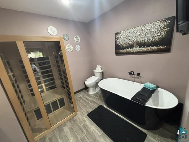 3454 Anderson Road Hibbing, MN 55746 - Photo 11 of 31 Full-size sauna featuring a light wood frame and glass paneling