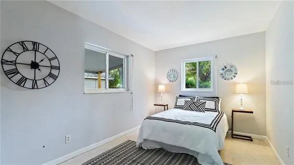 a bedroom with a bed and window