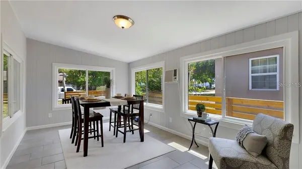 a view of a dining room with furniture window and outside view