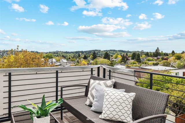 a view of a balcony with two chairs