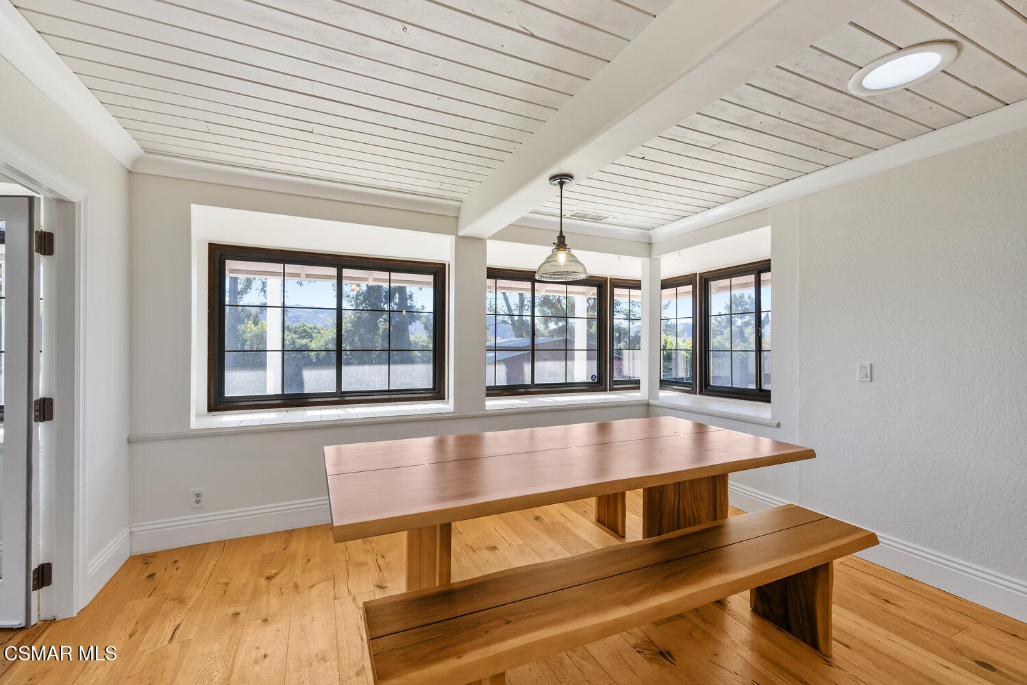 11316 Barranca Road Camarillo, CA 93012 - Photo 12 of 44 a living room with a table and windows