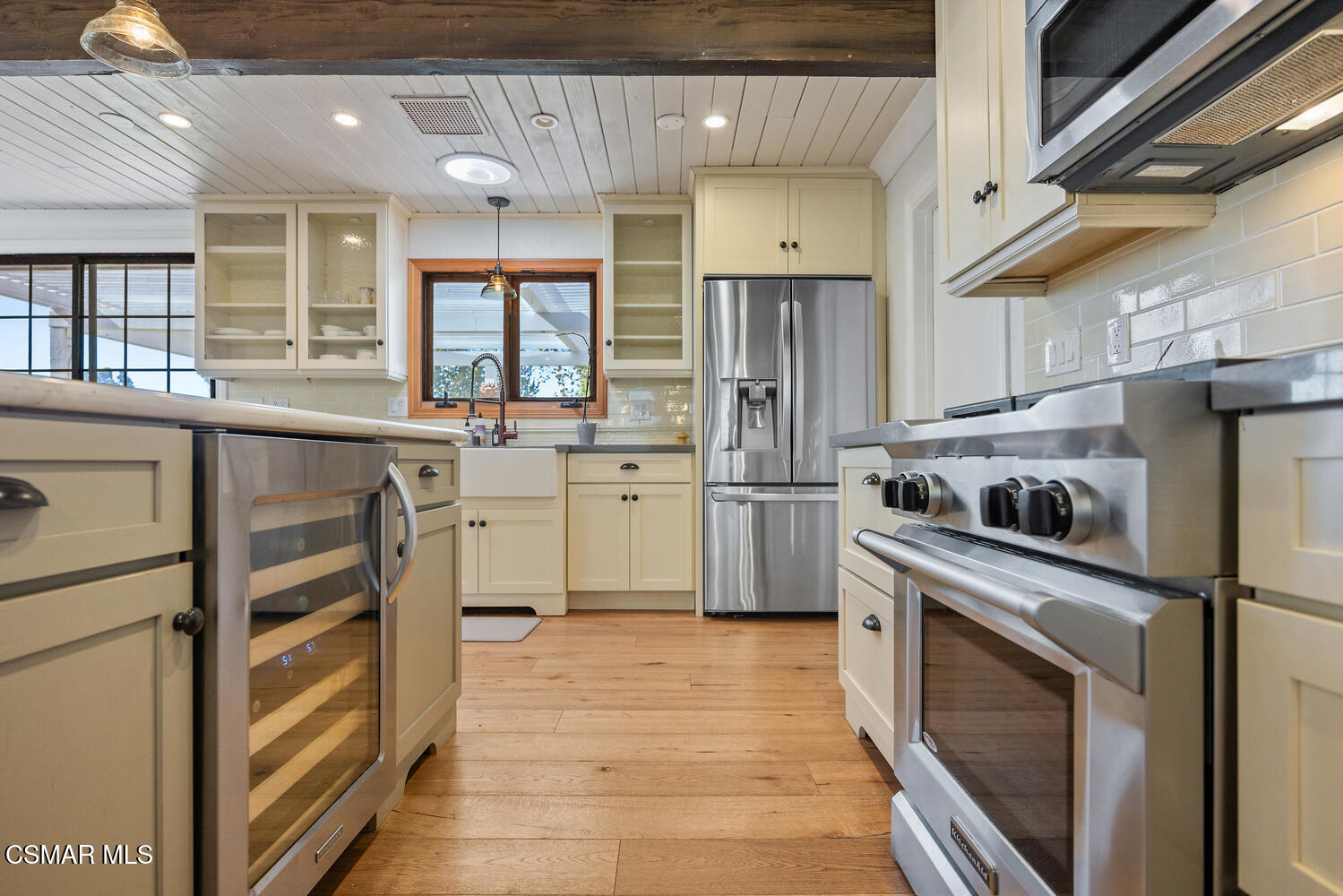 11316 Barranca Road Camarillo, CA 93012 - Photo 17 of 44 a kitchen with stainless steel appliances a refrigerator sink and cabinets