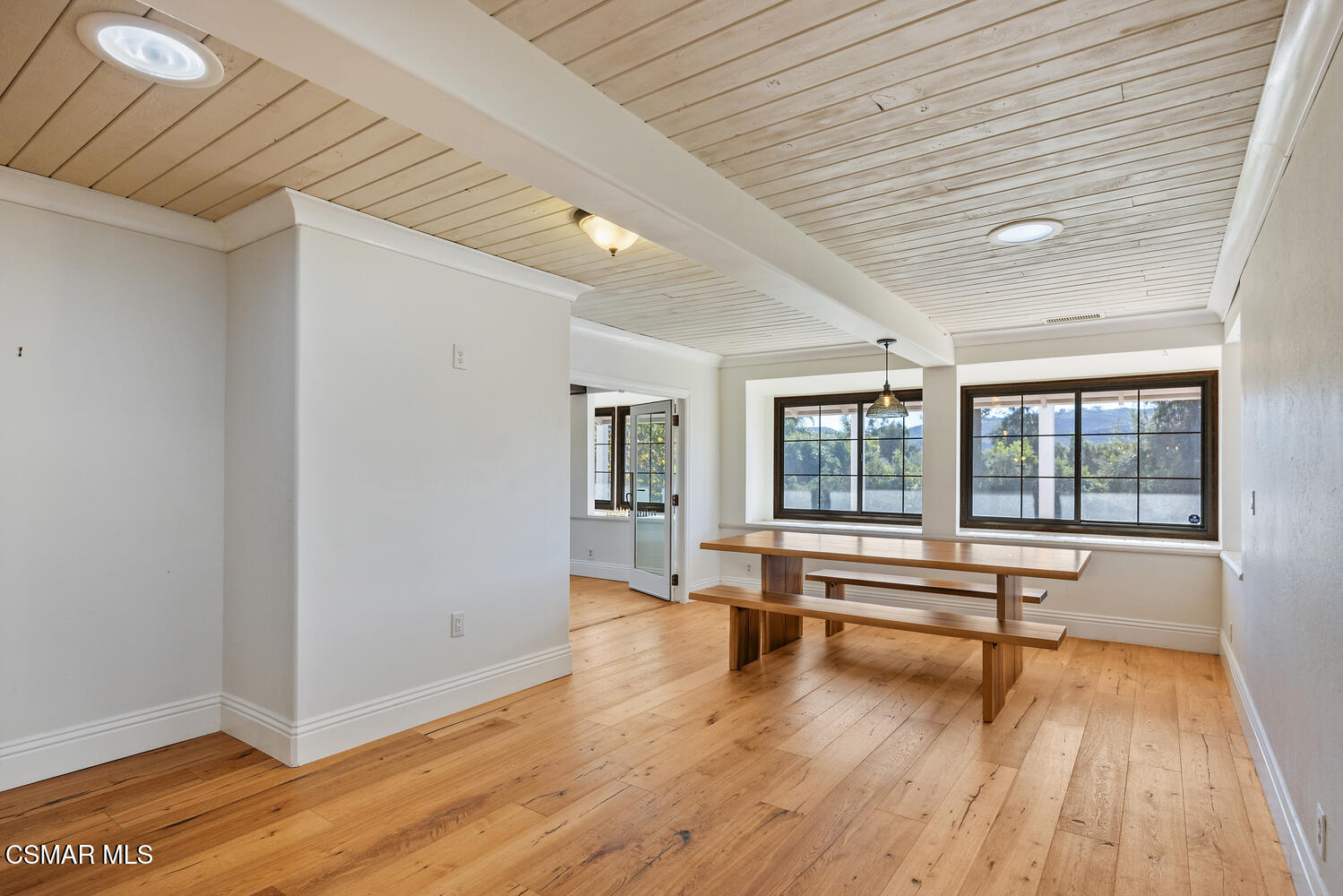 11316 Barranca Road Camarillo, CA 93012 - Photo 21 of 44 a view of an empty room with wooden floor and a window