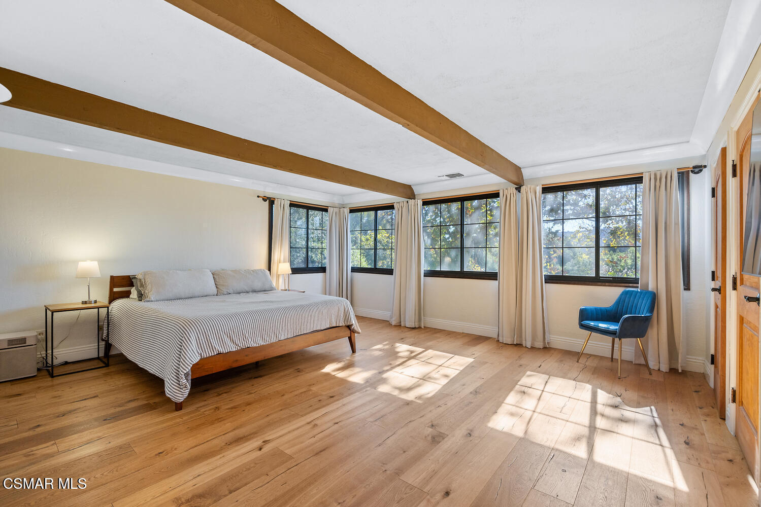 11316 Barranca Road Camarillo, CA 93012 - Photo 23 of 44 a spacious bedroom with a bed and a large window