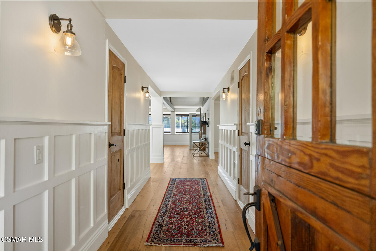 11316 Barranca Road Camarillo, CA 93012 - Photo 7 of 44 a view of a hallway with wooden floor and staircase