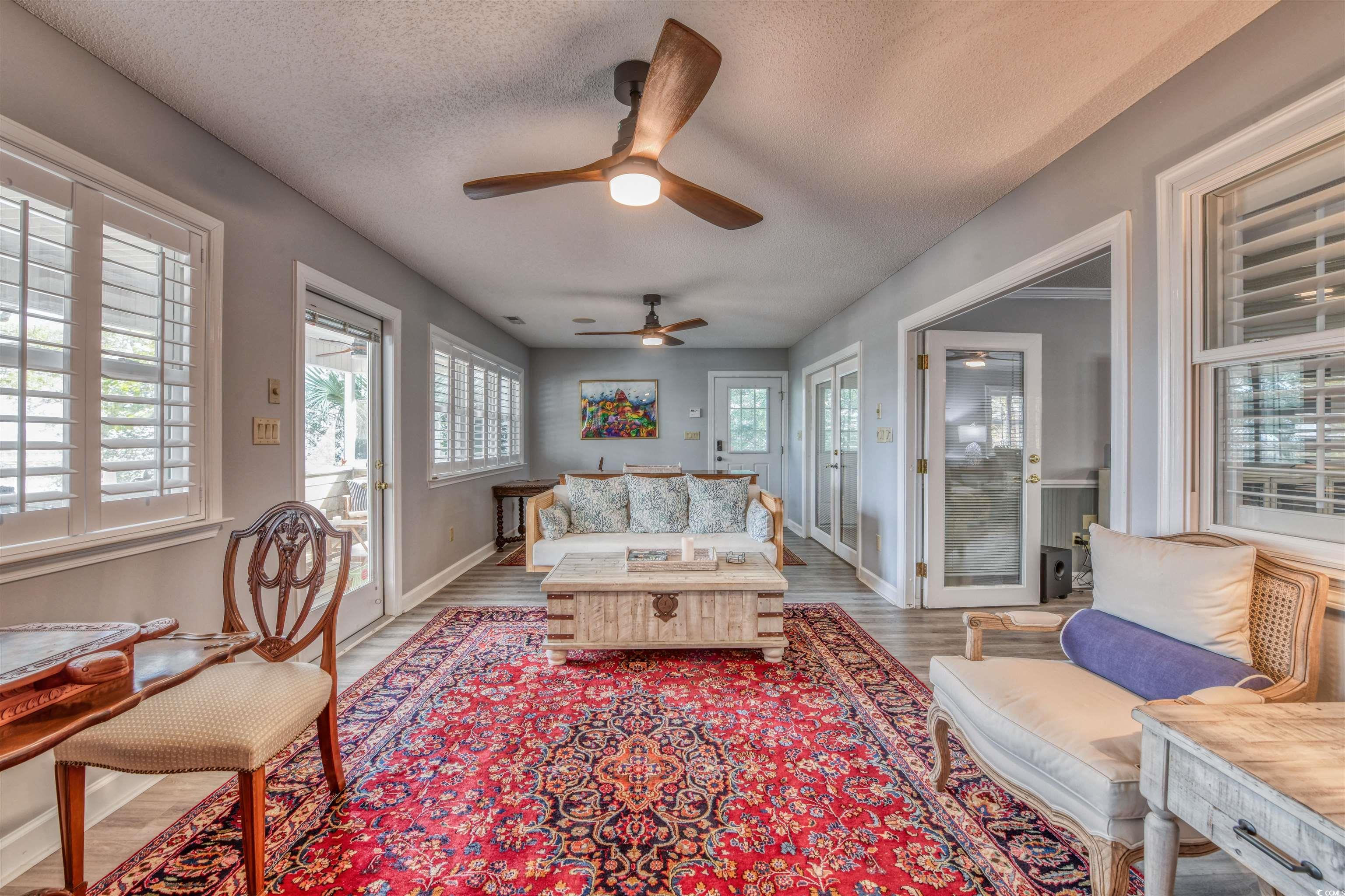 3714 Jordan Landing Road Murrells Inlet, SC 29576 - Photo 19 of 39 Living area with ceiling fan, a textured ceiling, and wood finished floors