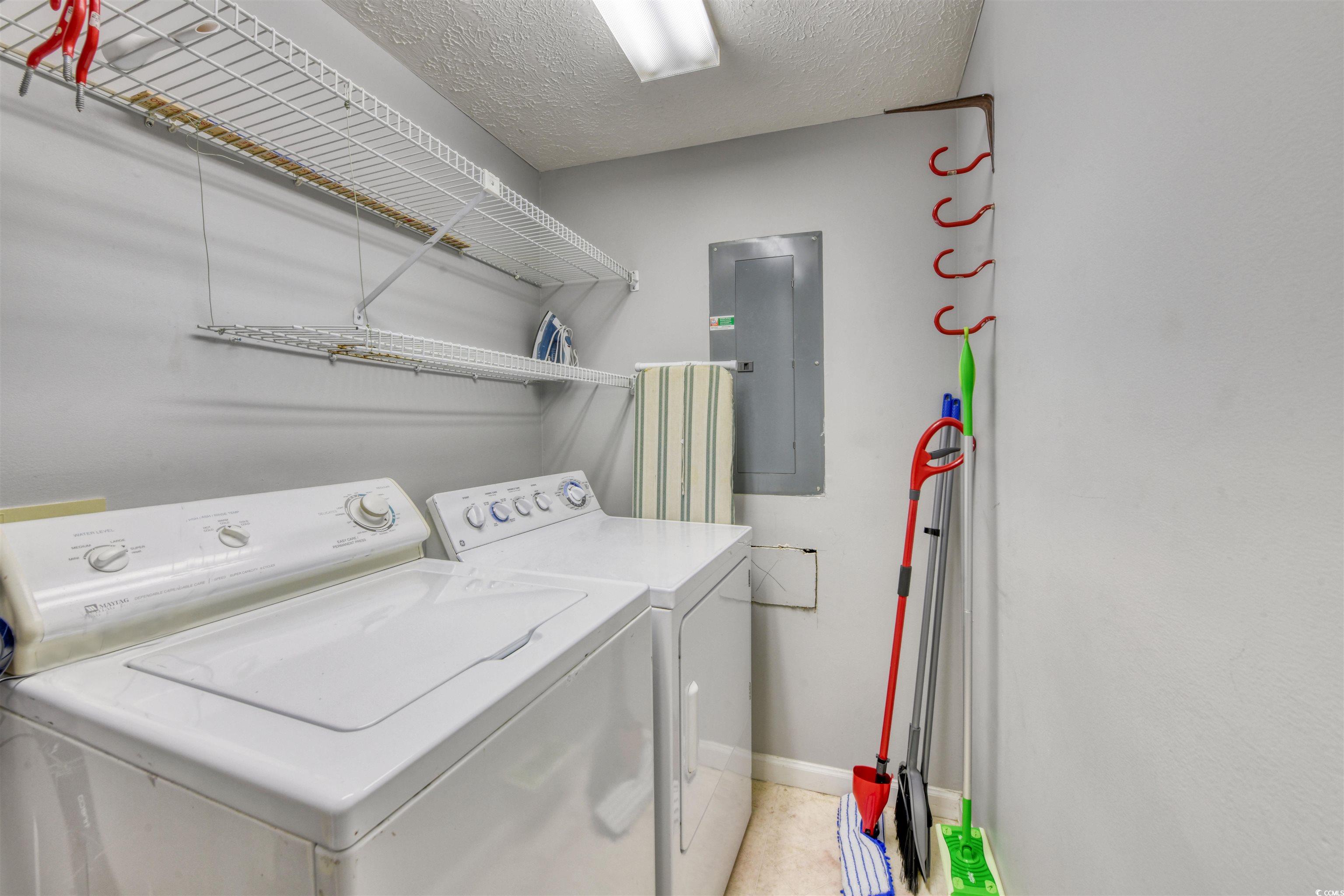 3714 Jordan Landing Road Murrells Inlet, SC 29576 - Photo 28 of 39 Washroom featuring a textured ceiling, electric panel, and washer and clothes dryer