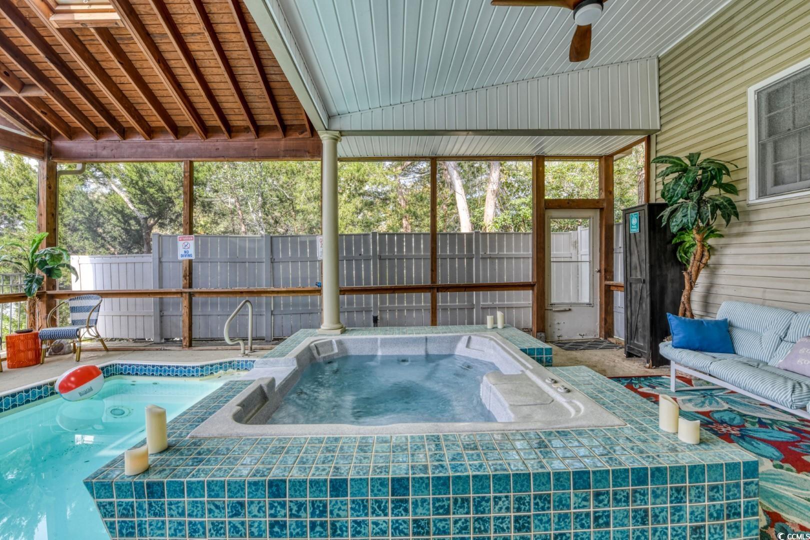 3714 Jordan Landing Road Murrells Inlet, SC 29576 - Photo 32 of 39 View of pool featuring a fenced backyard, an in-ground hot tub, and a sunroom