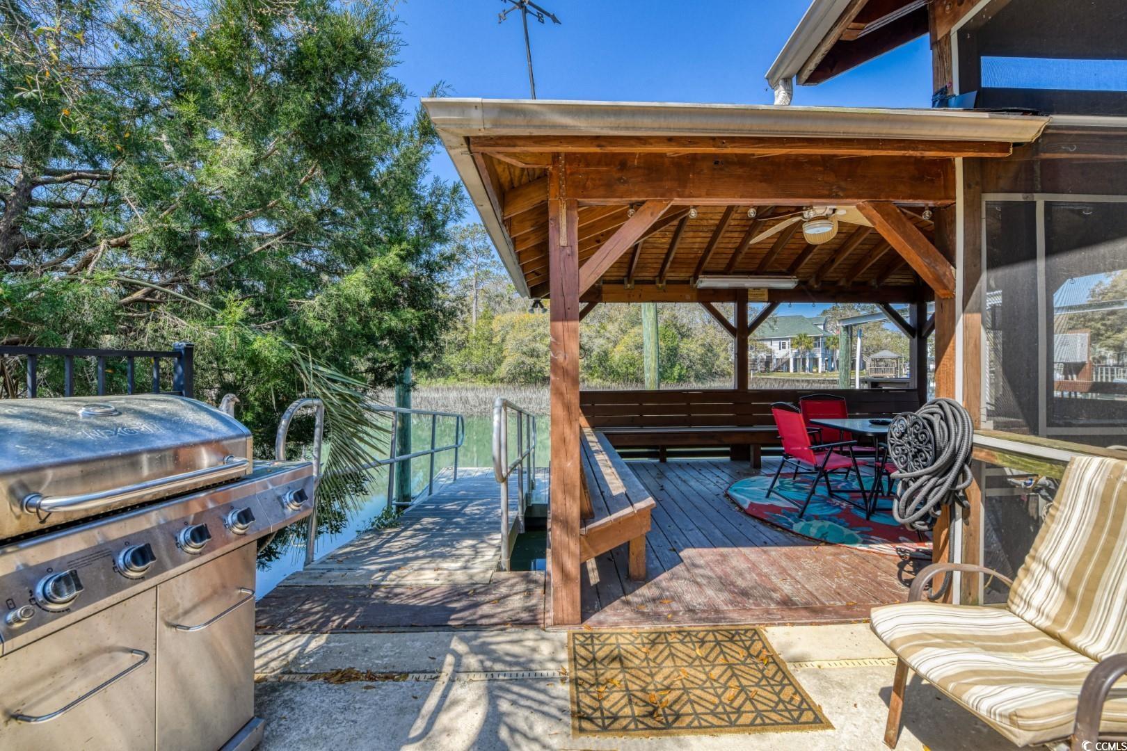 3714 Jordan Landing Road Murrells Inlet, SC 29576 - Photo 34 of 39 View of patio featuring grilling area and a deck