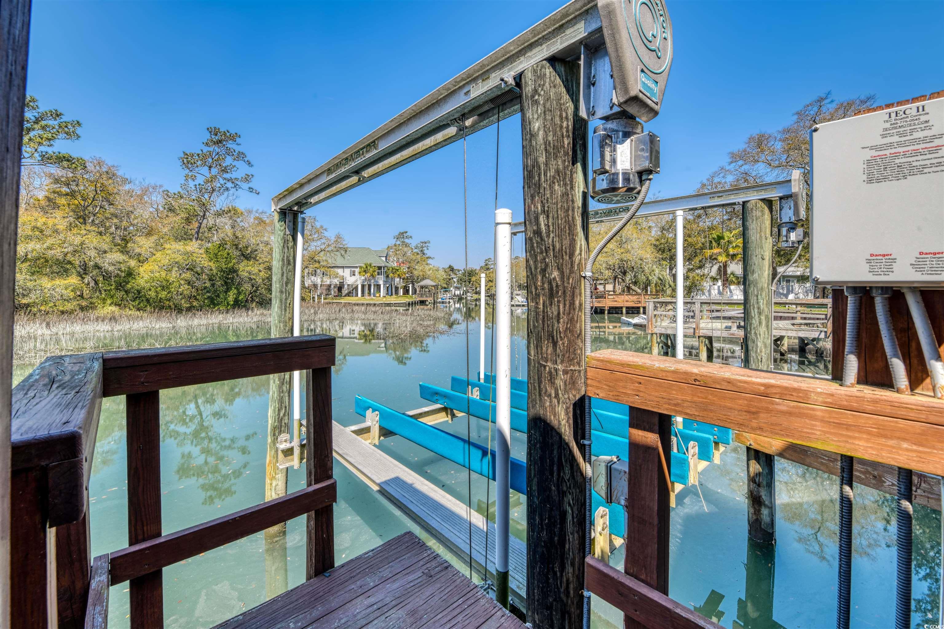 3714 Jordan Landing Road Murrells Inlet, SC 29576 - Photo 35 of 39 Dock featuring boat lift and a water view
