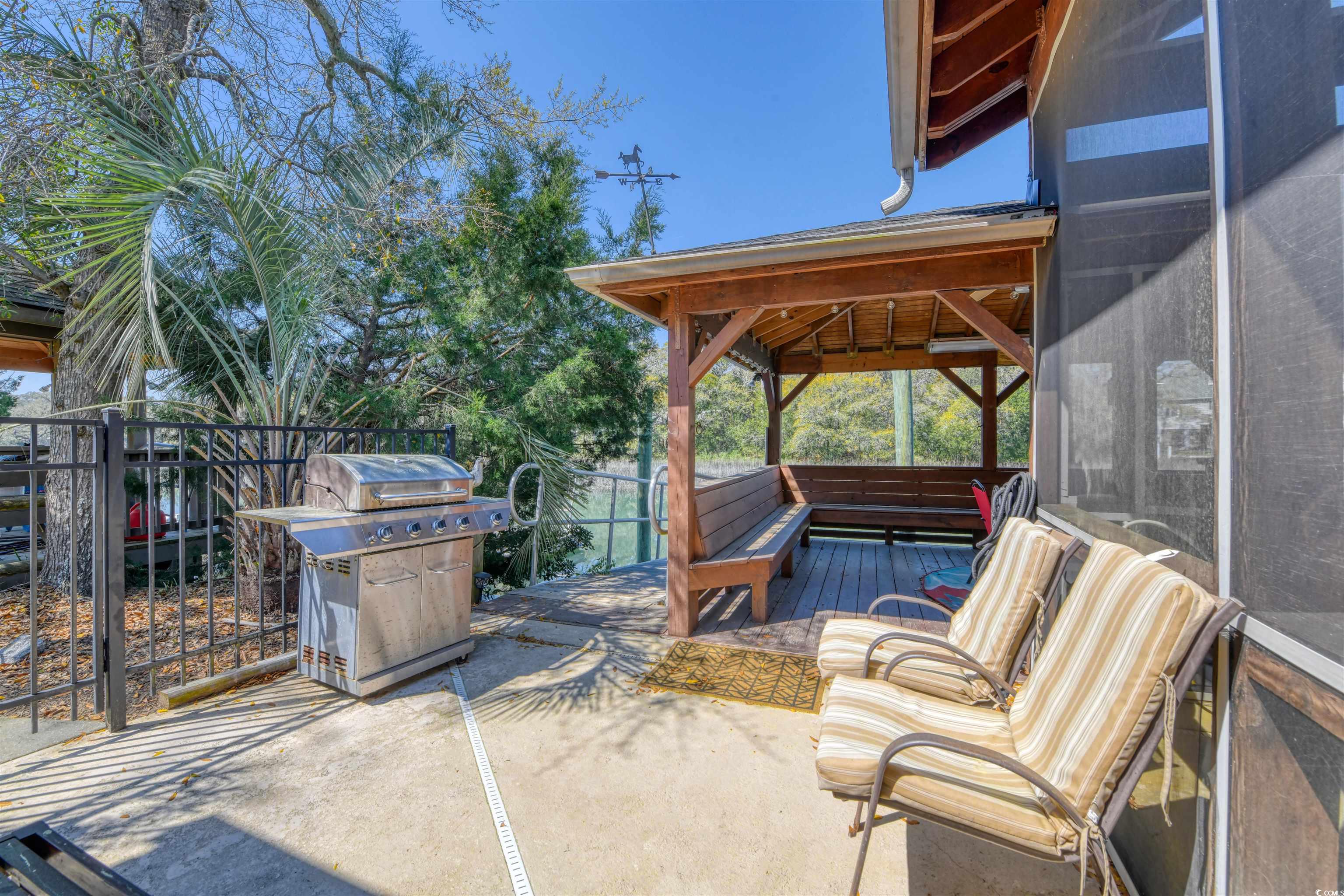 3714 Jordan Landing Road Murrells Inlet, SC 29576 - Photo 38 of 39 View of patio featuring a grill and a deck