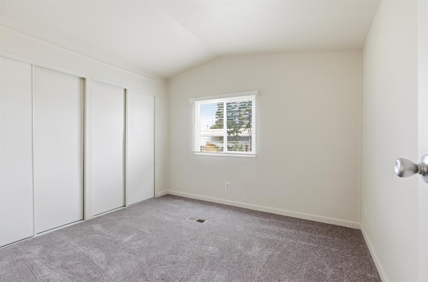 2307 Oakdale Road, Unit 15 Modesto, CA 95355 - Photo 14 of 17 an empty room with windows