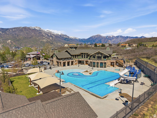 2007 Fielding Hill Lane Draper, UT 84020 - Photo 77 of 83 Community aquatic center featuring a large swimming pool, water slides, and shade structures