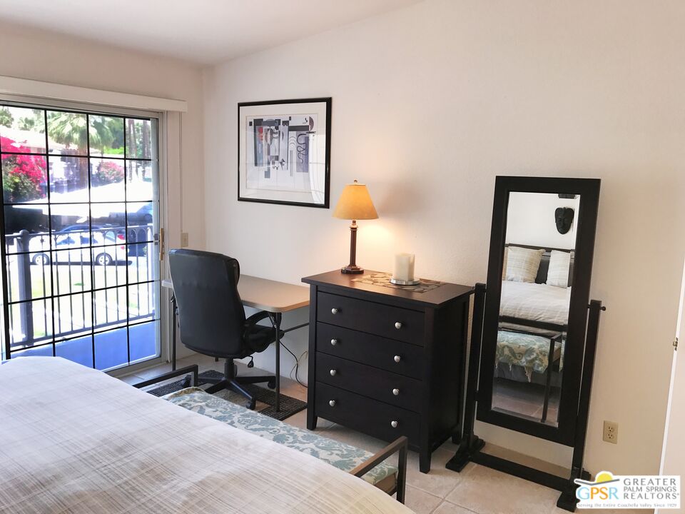 2701 East Mesquite Avenue, Unit GG180 Palm Springs, CA 92264 - Photo 13 of 26 a view of a workspace with furniture and a window