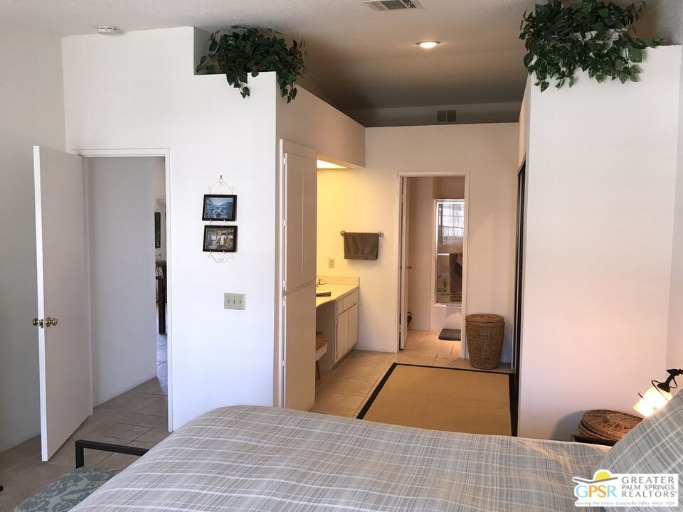 2701 East Mesquite Avenue, Unit GG180 Palm Springs, CA 92264 - Photo 14 of 26 a bathroom with a sink and a shower