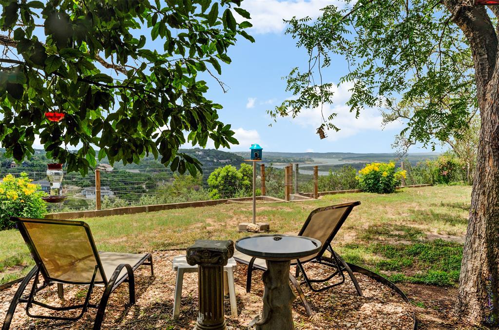 21013 Ridgeview Loop Lago Vista, TX 78645 - Photo 15 of 16 View of green lawn with a patio