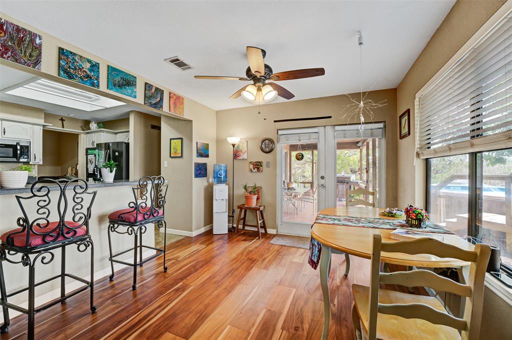 21013 Ridgeview Loop Lago Vista, TX 78645 - Photo 7 of 16 Breakfast area with bar seating, french doors to the back patio area. Incredible views from the window