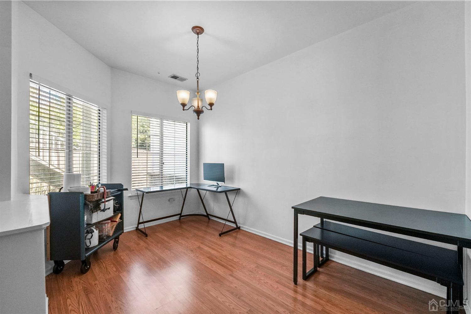 17 Bentley Court Bedminster, NJ 07921 - Photo 17 of 44 a reading room with wooden floor and windows