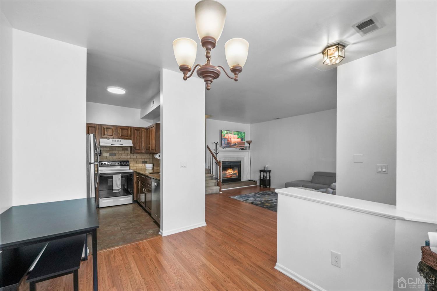 17 Bentley Court Bedminster, NJ 07921 - Photo 18 of 44 a view of kitchen and dining room with wooden floor