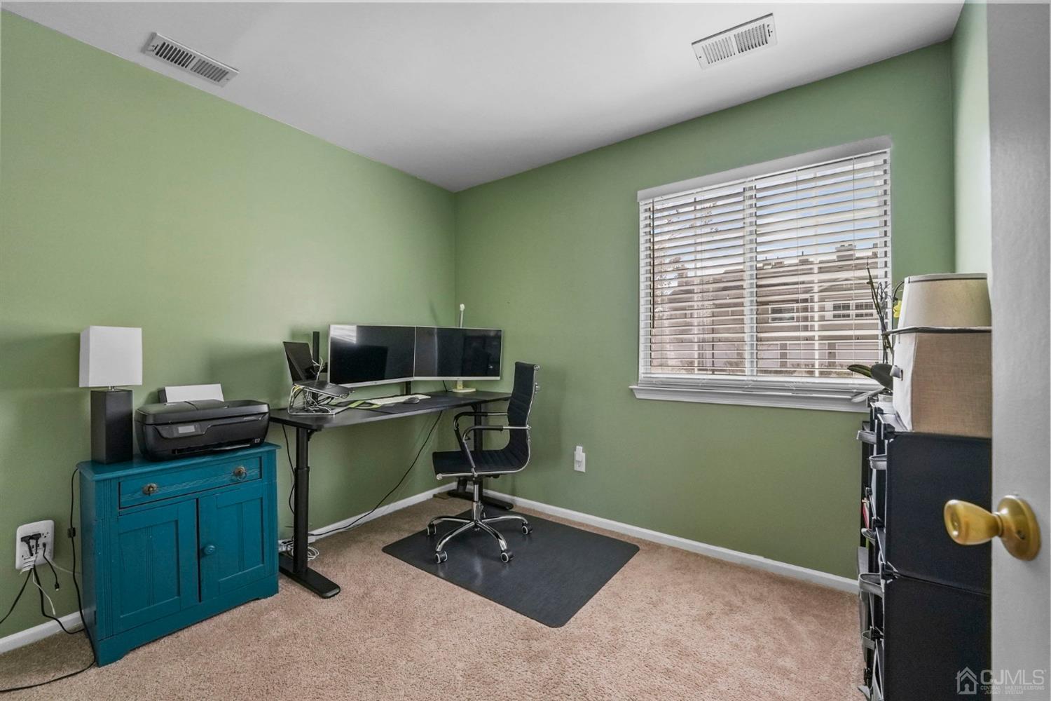 17 Bentley Court Bedminster, NJ 07921 - Photo 20 of 44 a view of a workspace with furniture and a window