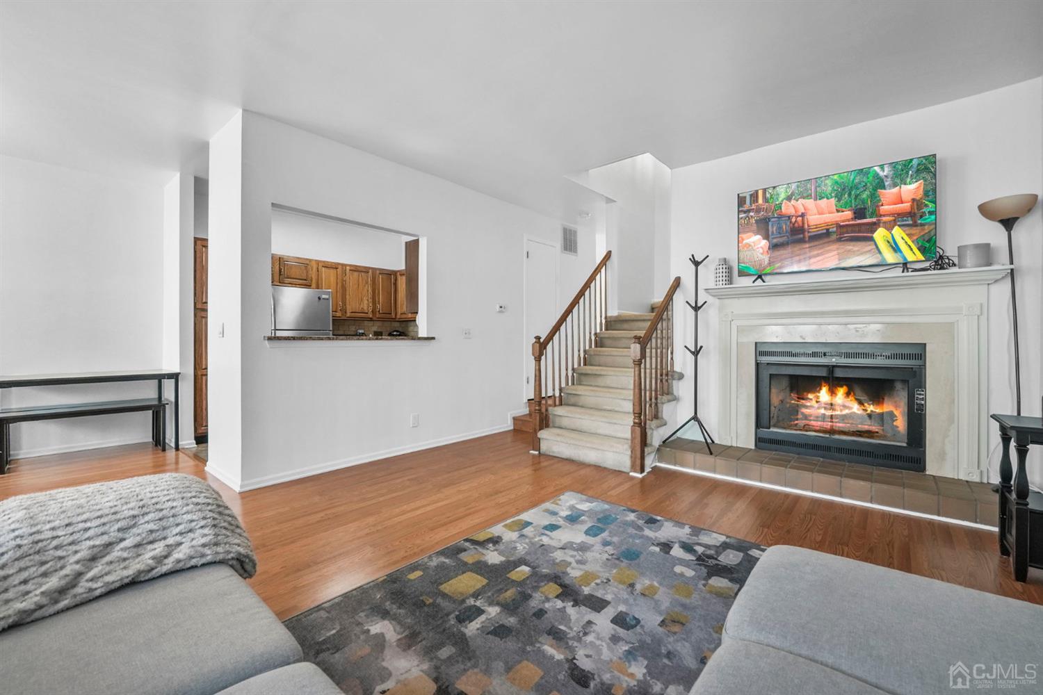17 Bentley Court Bedminster, NJ 07921 - Photo 2 of 44 a living room with furniture and a fireplace