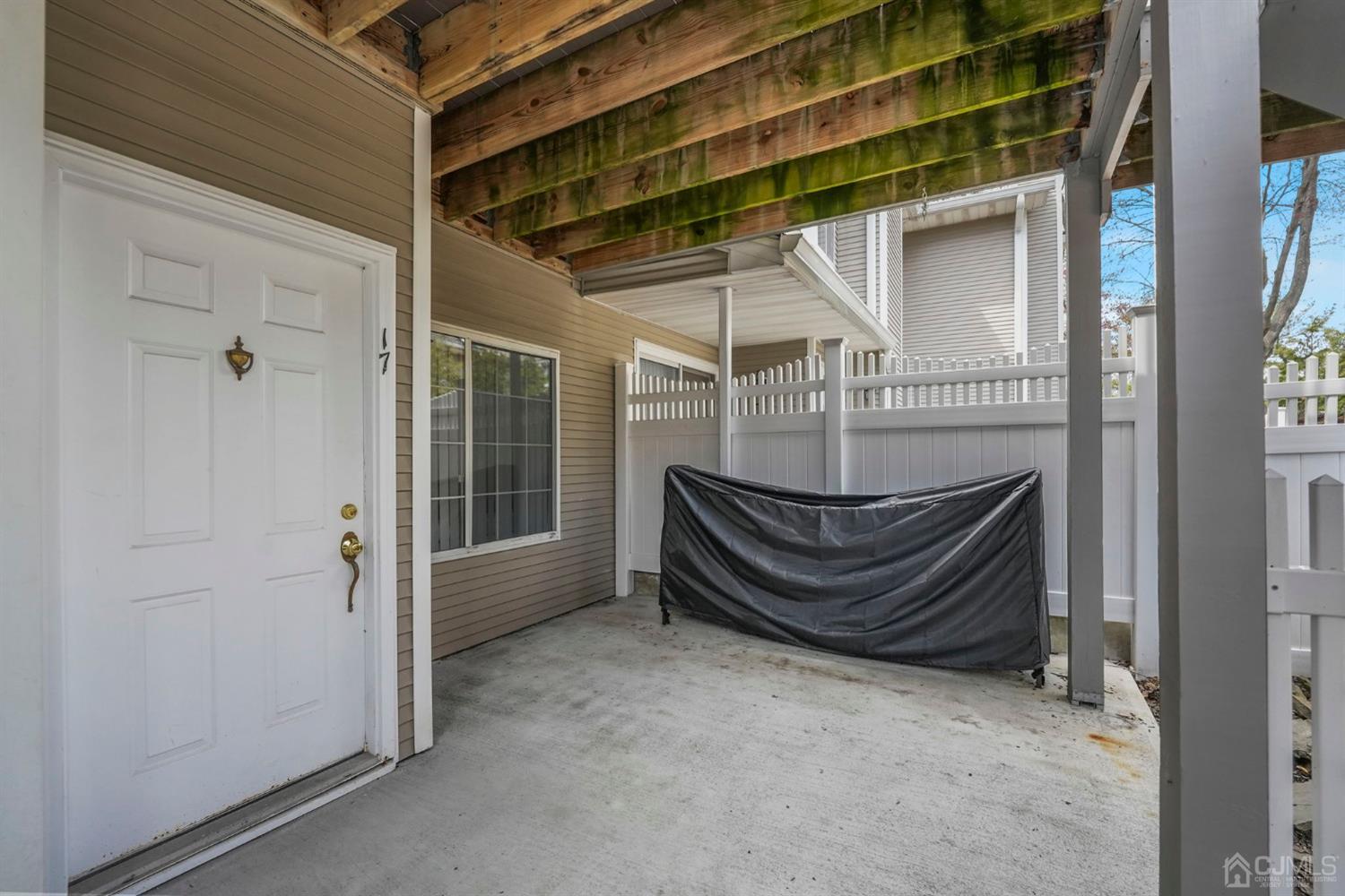 17 Bentley Court Bedminster, NJ 07921 - Photo 27 of 44 a bench sitting in front of a door