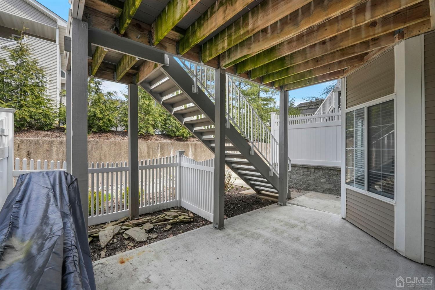 17 Bentley Court Bedminster, NJ 07921 - Photo 28 of 44 a view of a porch with wooden floor and iron stairs