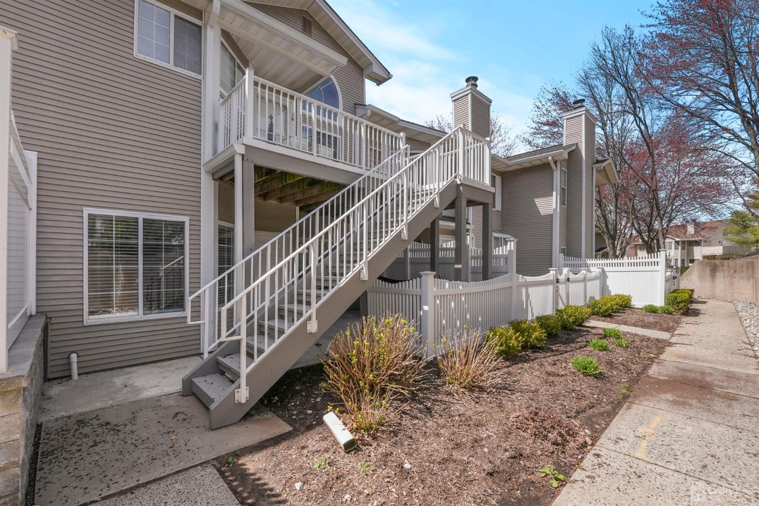 17 Bentley Court Bedminster, NJ 07921 - Photo 29 of 44 a view of a house with wooden fence