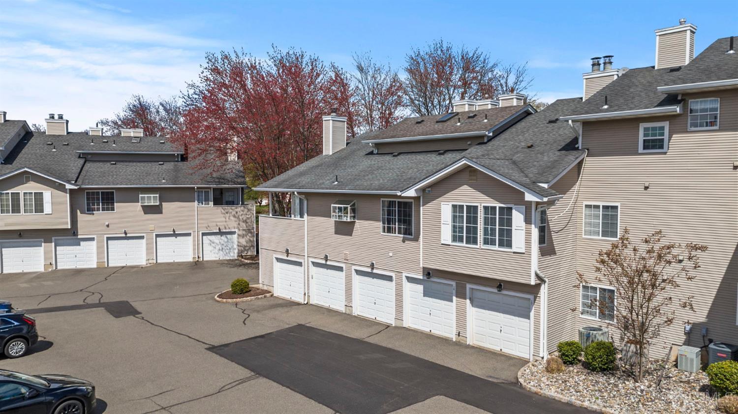 17 Bentley Court Bedminster, NJ 07921 - Photo 30 of 44 a front view of a house with a garden