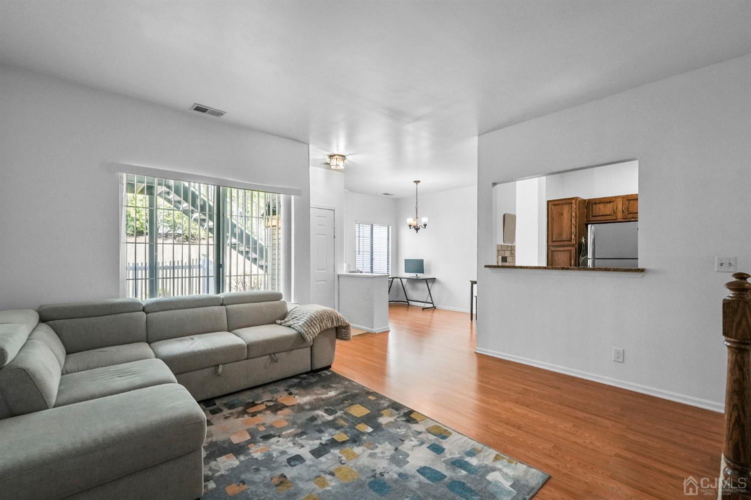 17 Bentley Court Bedminster, NJ 07921 - Photo 3 of 44 a living room with furniture and a large window