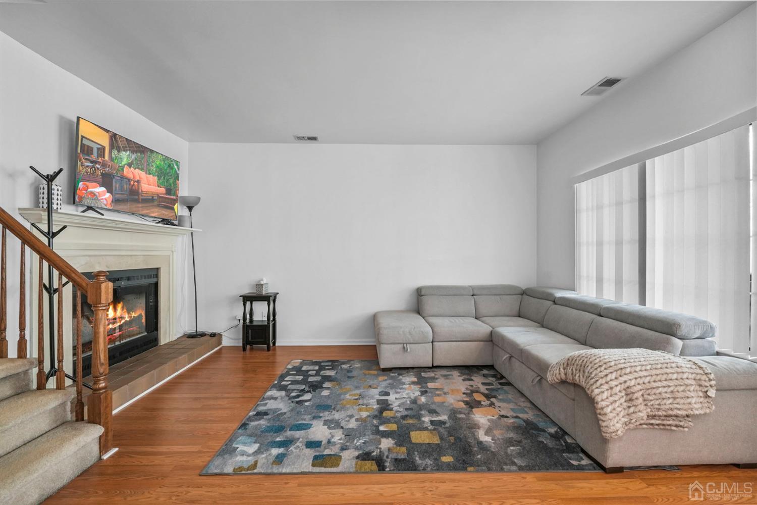 17 Bentley Court Bedminster, NJ 07921 - Photo 5 of 44 a living room with furniture and a fireplace