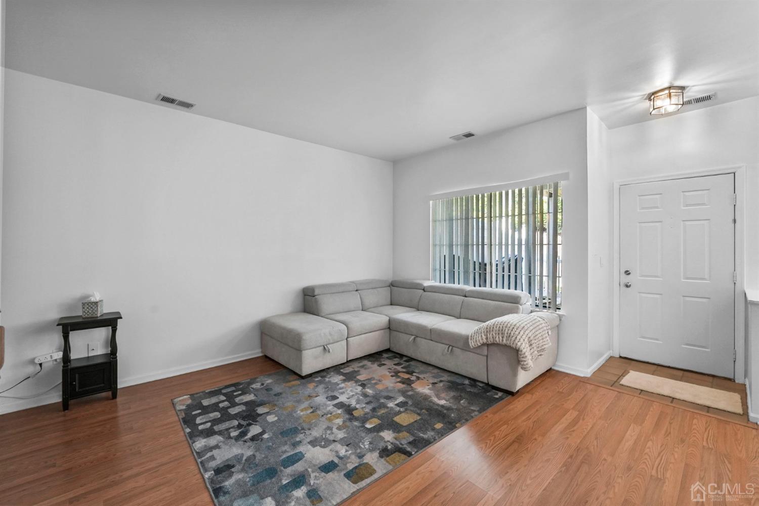 17 Bentley Court Bedminster, NJ 07921 - Photo 6 of 44 a living room with furniture and a rug