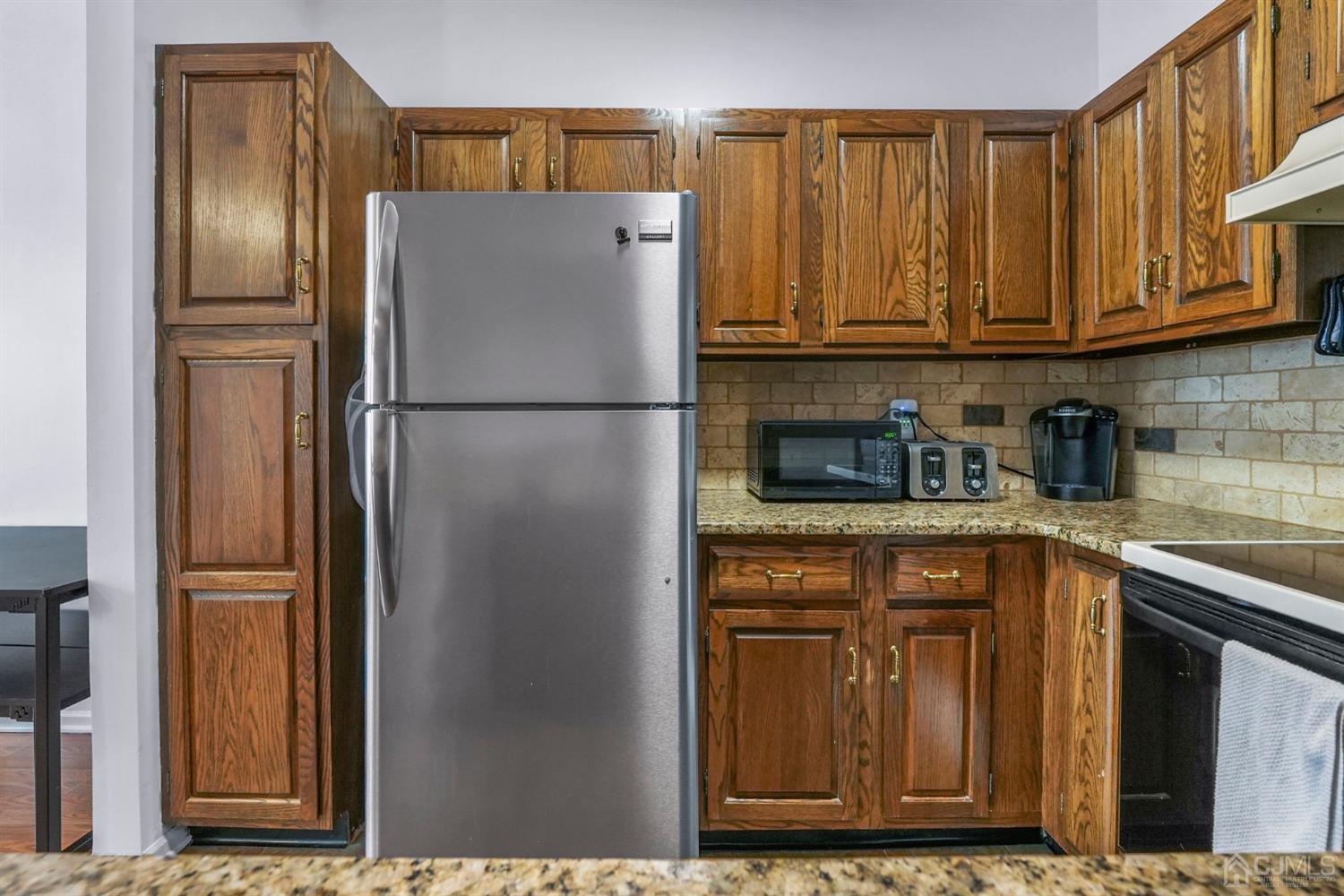 17 Bentley Court Bedminster, NJ 07921 - Photo 8 of 44 a kitchen with stainless steel appliances granite countertop a refrigerator and a sink
