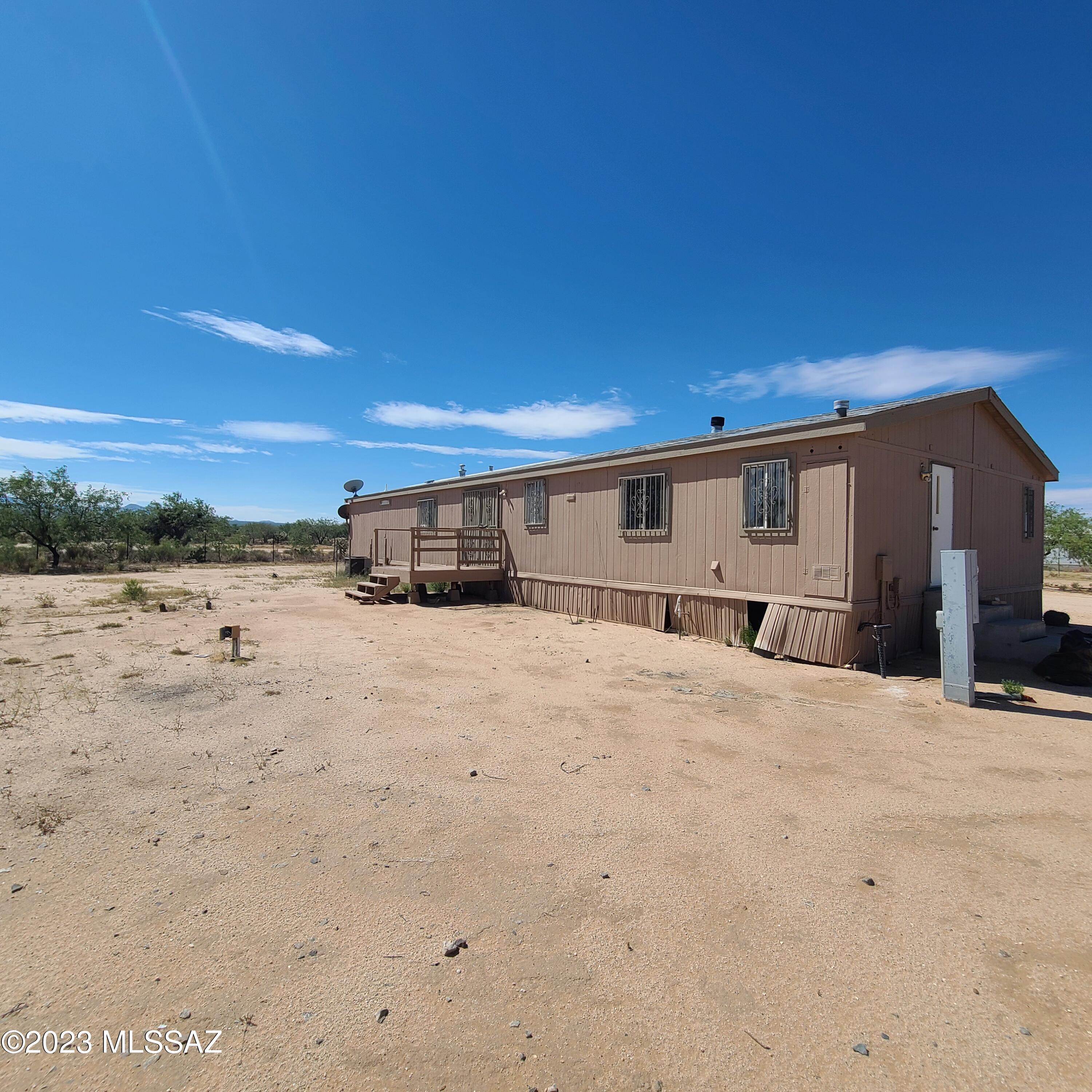 8896 South Marstellar Road Tucson, AZ 85736 - Photo 32 of 39 a view of big yard with wooden fence