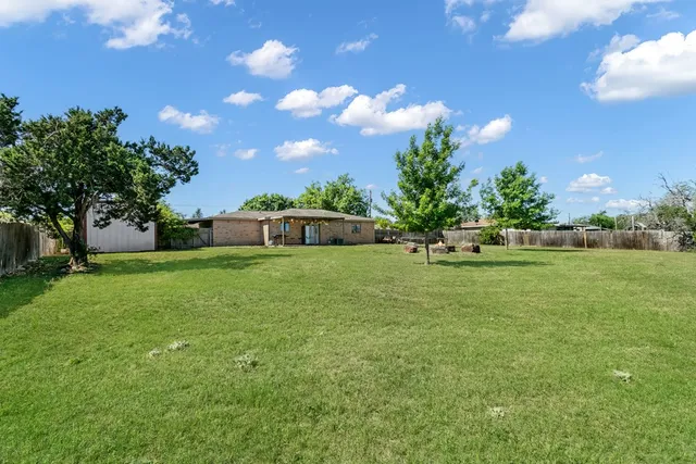 a view of a house with a big yard