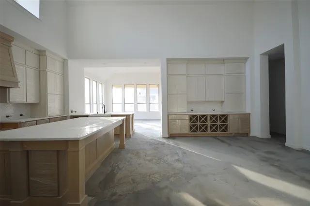 a kitchen with stainless steel appliances granite countertop a sink and a granite counter tops