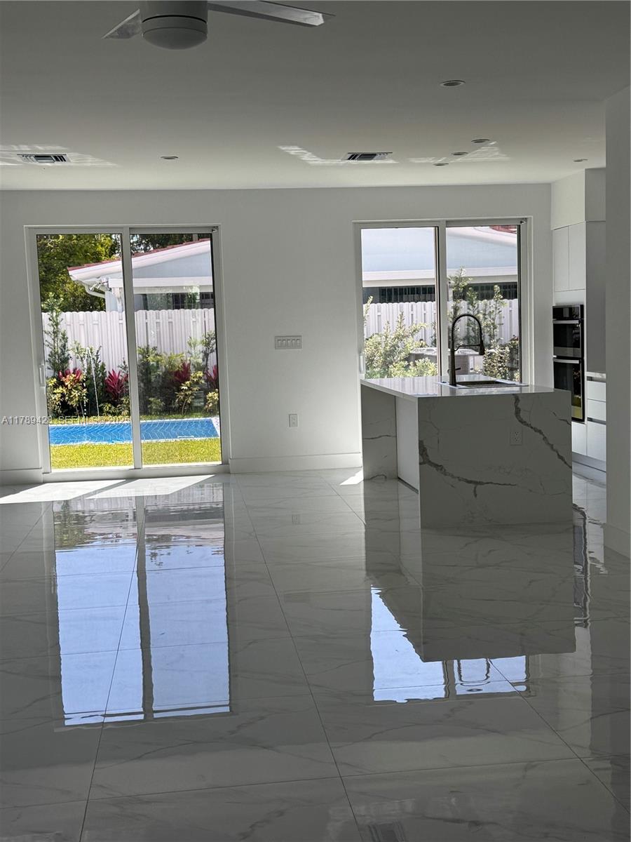 900 Southwest 24th Road Miami, FL 33129 - Photo 13 of 27 a living room with window