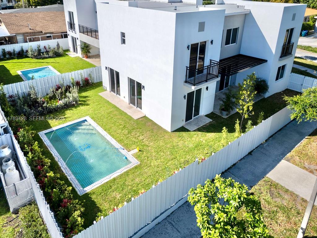 900 Southwest 24th Road Miami, FL 33129 - Photo 3 of 27 a view of a house with a yard