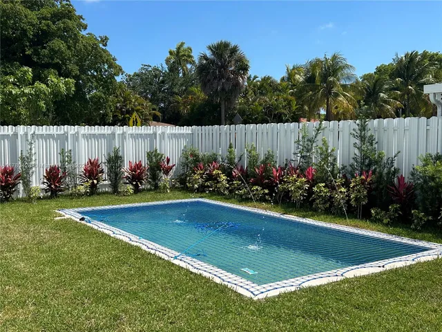 a view of a fountain in the yard