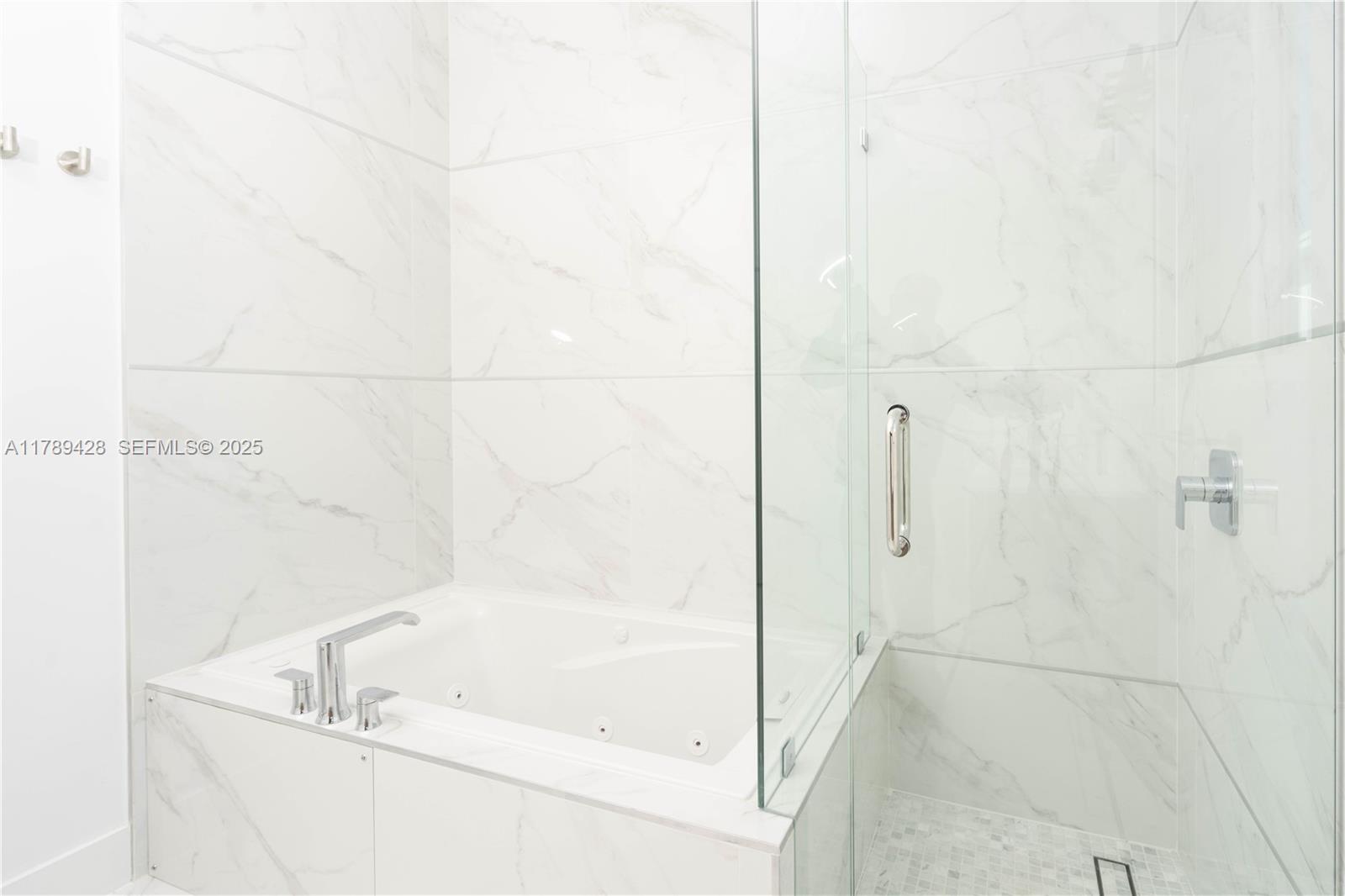 900 Southwest 24th Road Miami, FL 33129 - Photo 7 of 27 a bathroom with a bathtub