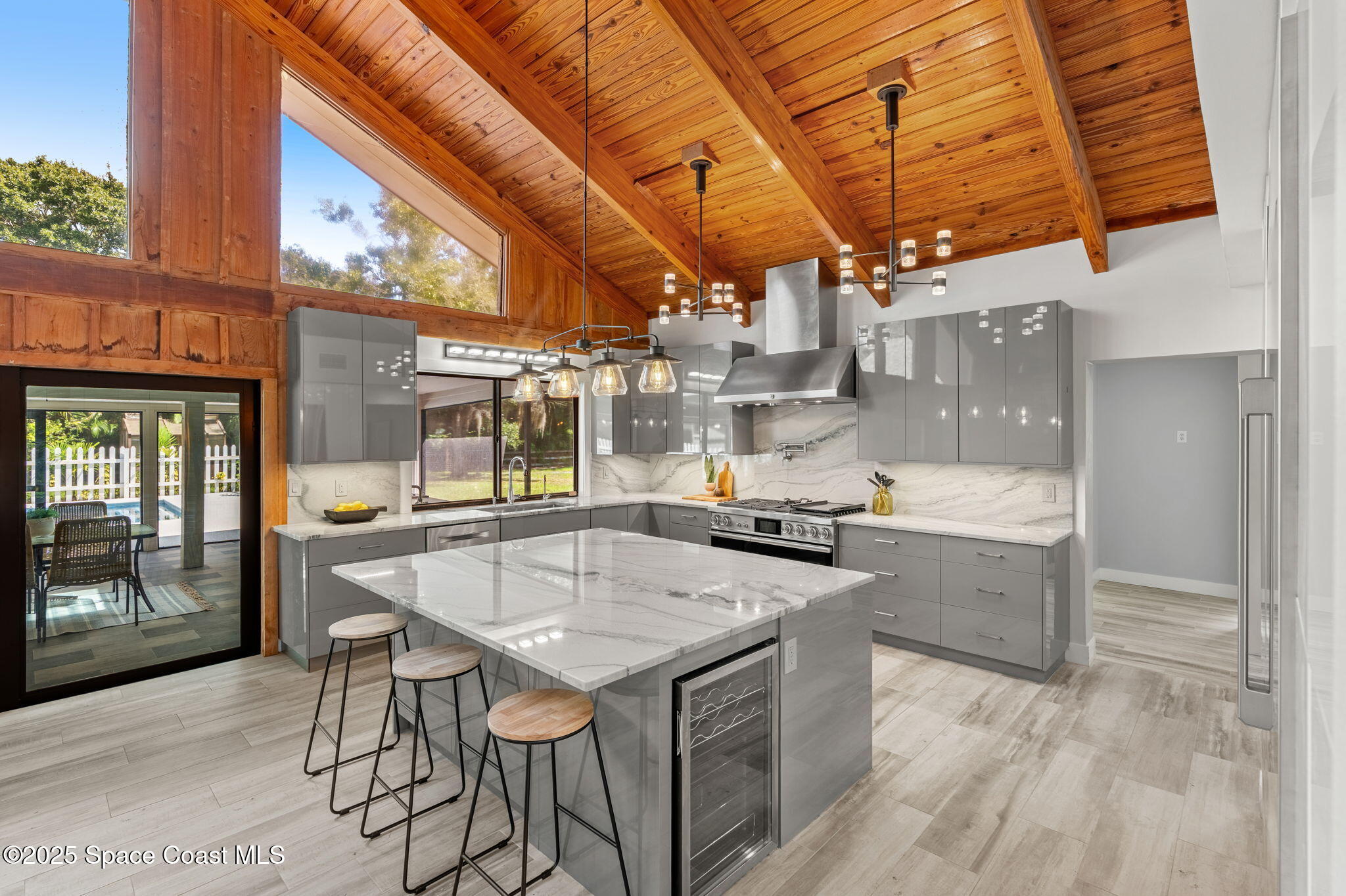 2187 Turtle Mound Road Melbourne, FL 32934 - Photo 13 of 77 a kitchen with stainless steel appliances granite countertop a sink and cabinets