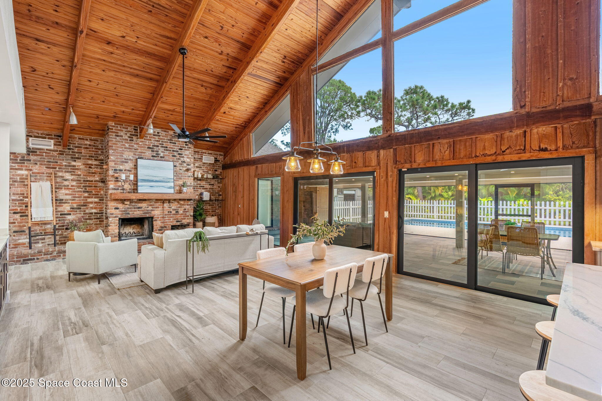 2187 Turtle Mound Road Melbourne, FL 32934 - Photo 18 of 77 a view of a dining room with furniture window and wooden floor