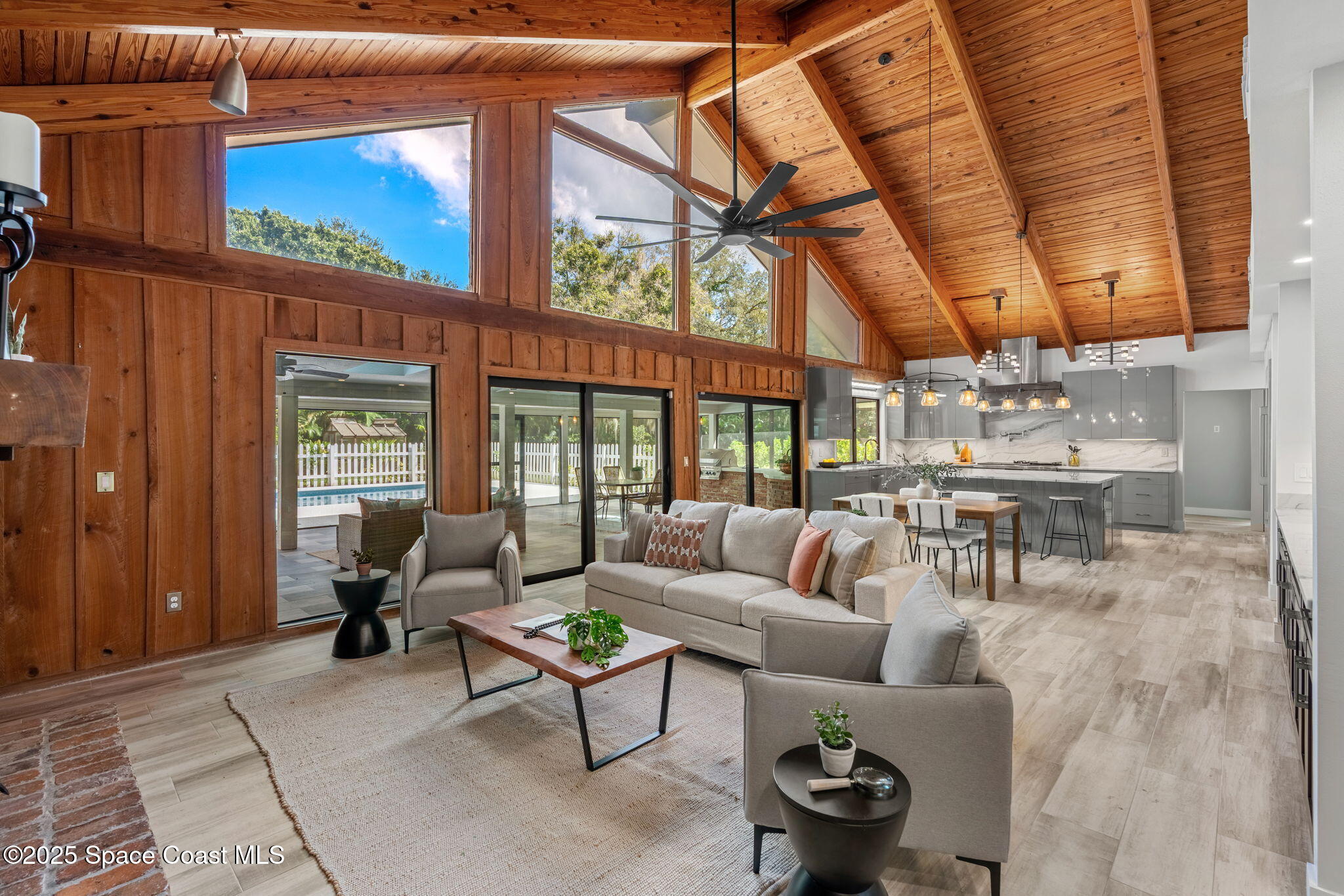 2187 Turtle Mound Road Melbourne, FL 32934 - Photo 24 of 77 a living room with furniture and a large window