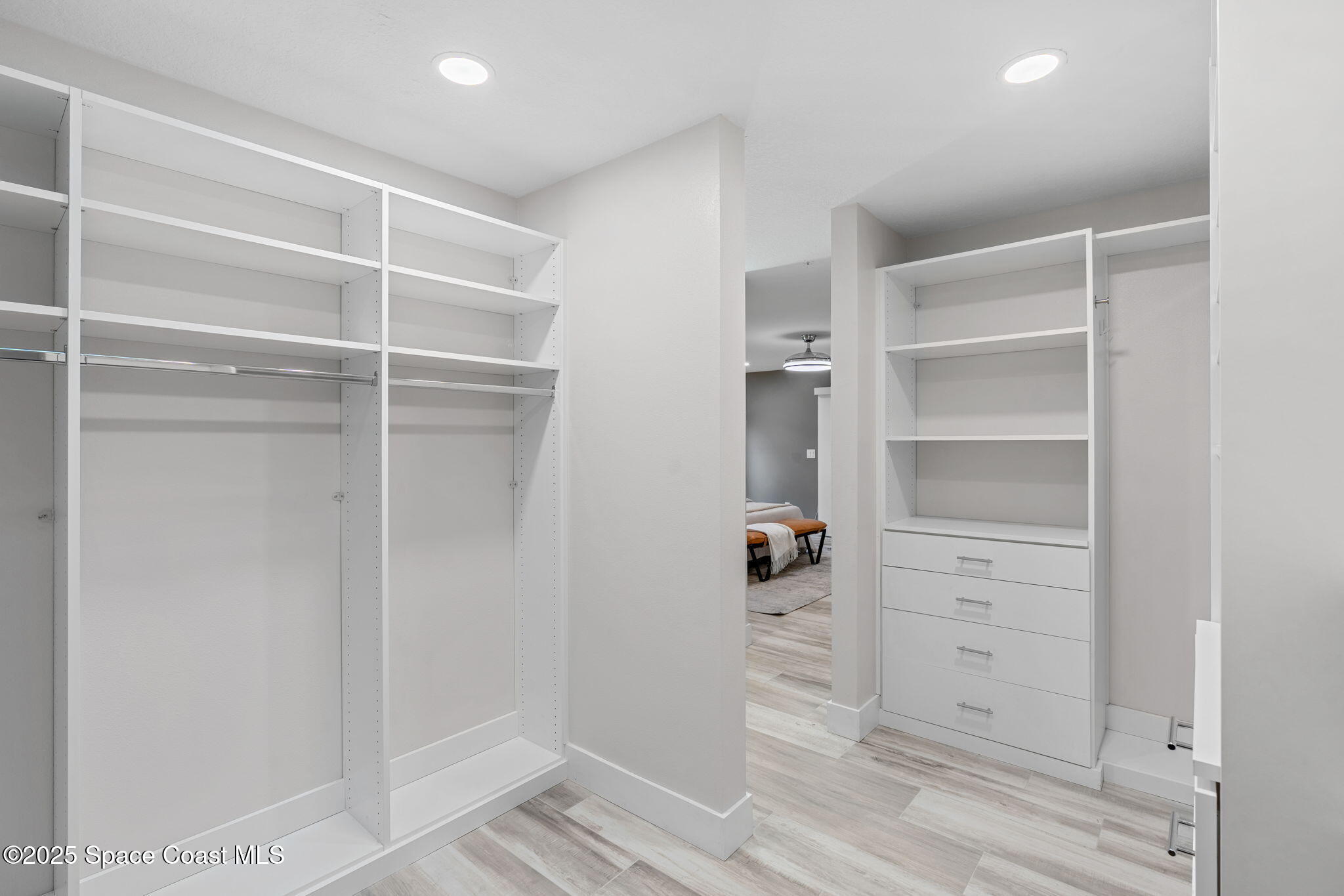 2187 Turtle Mound Road Melbourne, FL 32934 - Photo 38 of 77 a view of walk in closet with empty racks