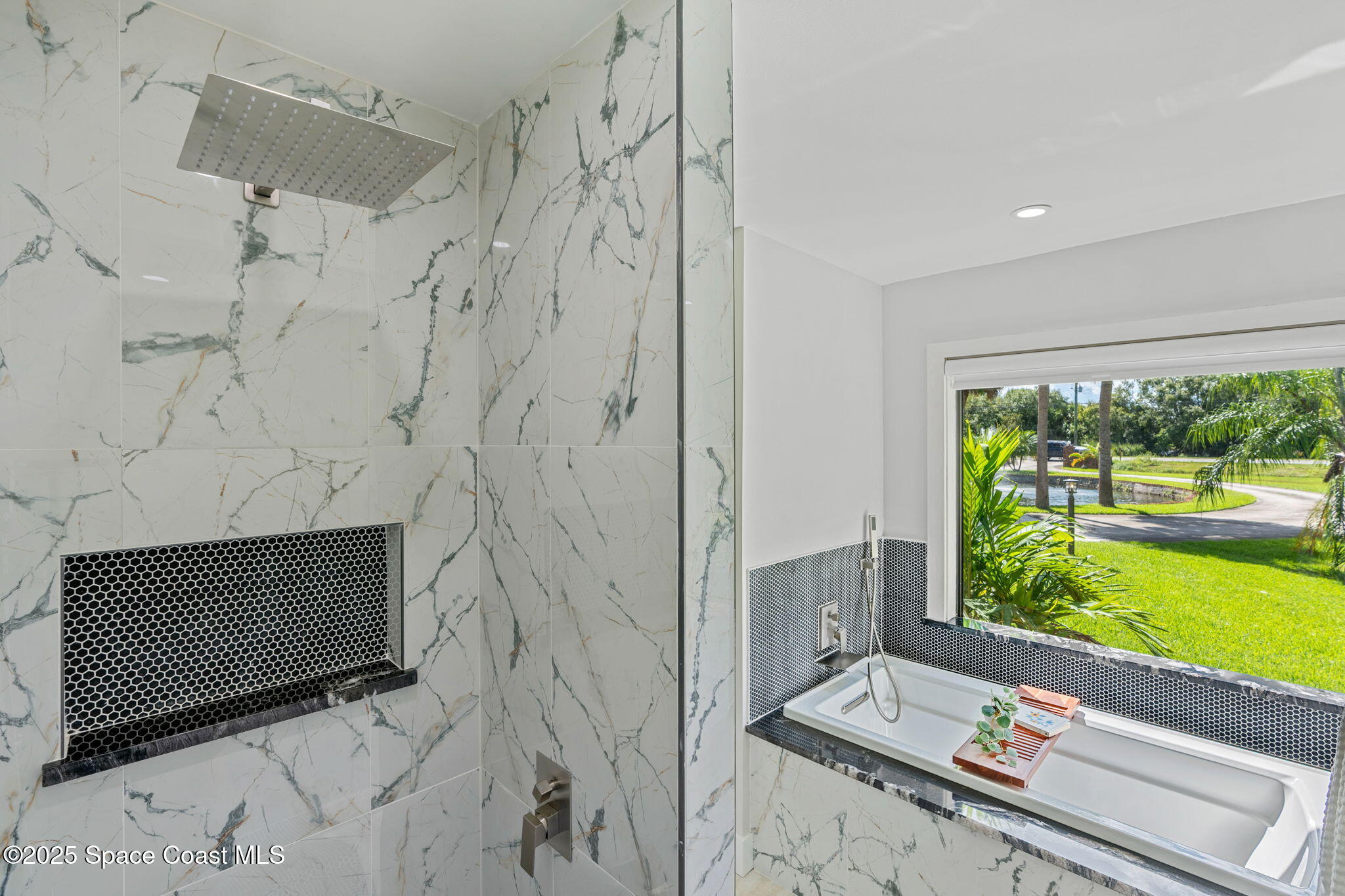 2187 Turtle Mound Road Melbourne, FL 32934 - Photo 42 of 77 a living room with a fireplace furniture and a floor to ceiling window