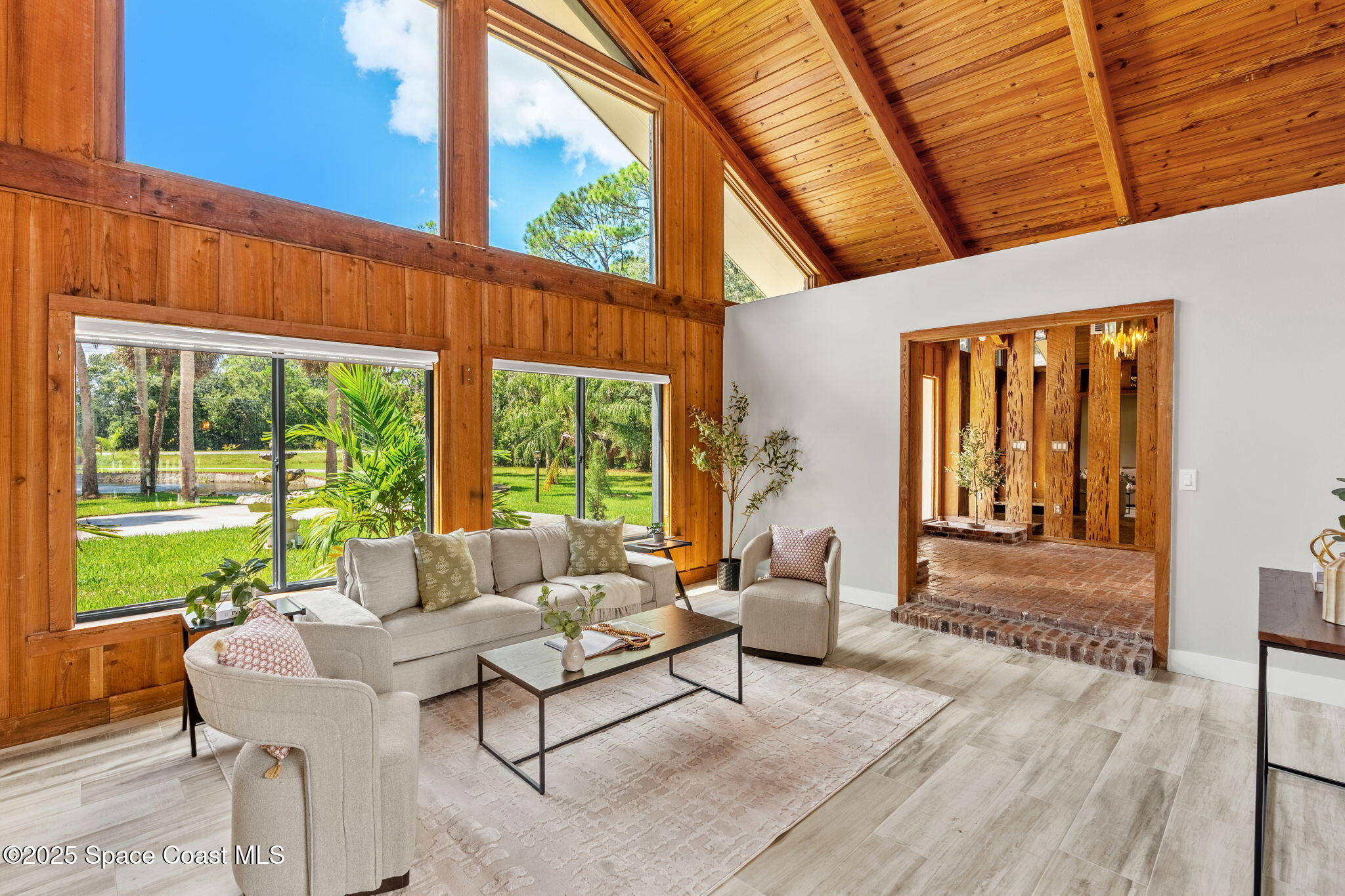 2187 Turtle Mound Road Melbourne, FL 32934 - Photo 9 of 77 a living room with furniture and a large window