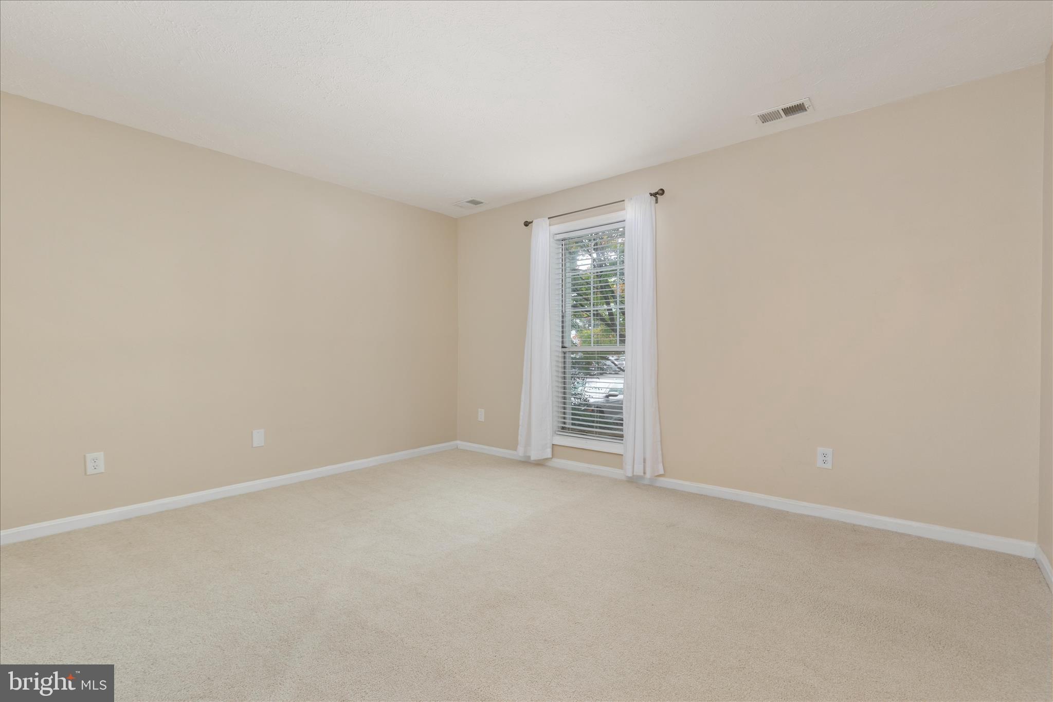 10110 Oakton Terrace Road, Unit 10110 Oakton, VA 22124 - Photo 17 of 27 Large, well-lit Bedroom