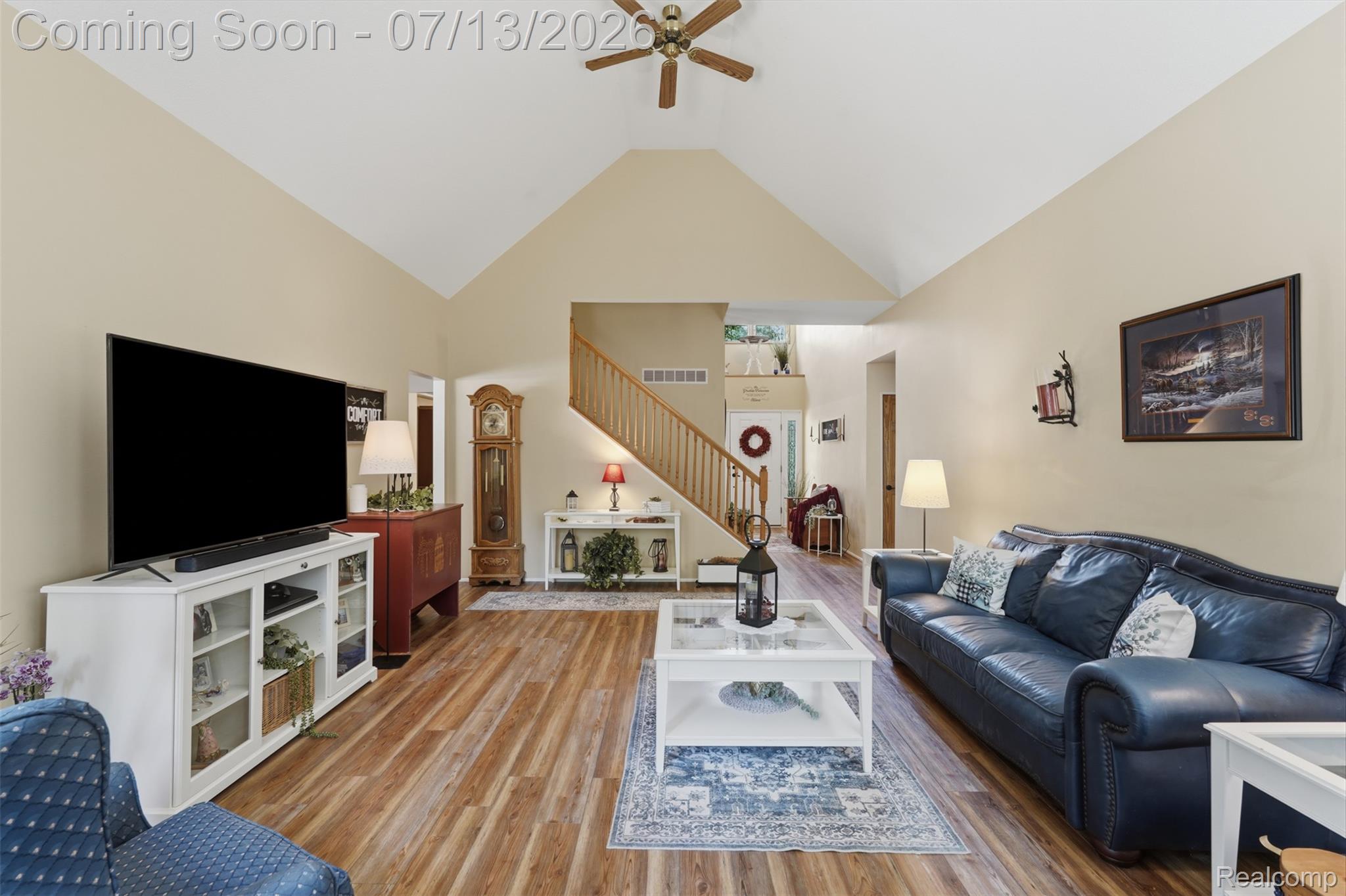 10525 Antcliff Road Brooklyn, MI 49230 - Photo 11 of 80 Spacious living area featuring a stone fireplace, vaulted ceiling, and peaceful views of nature